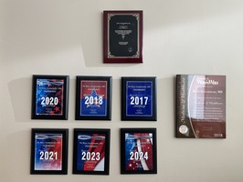 A wall of awards for Washington Ear Associates