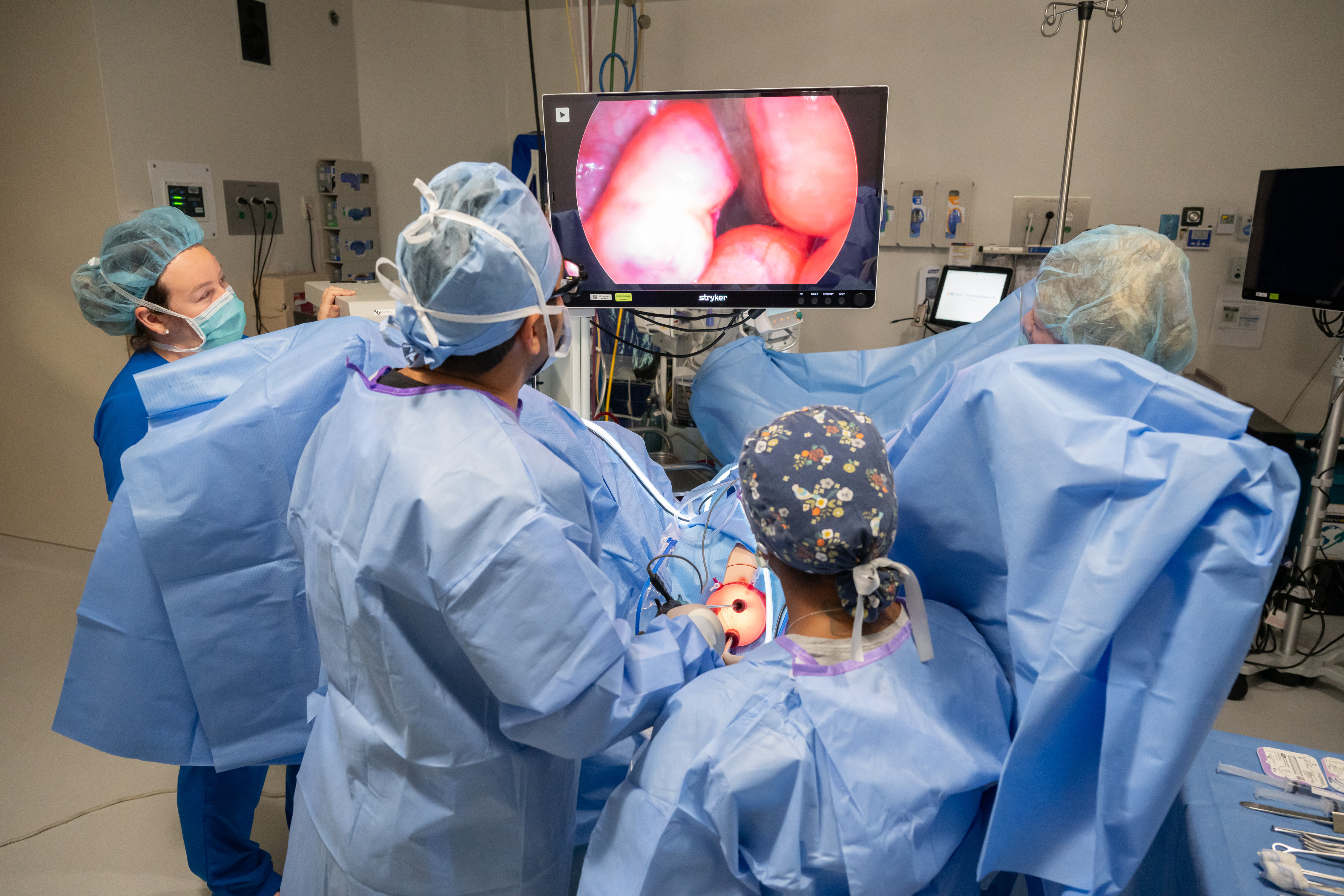 Providers and a patient during surgery