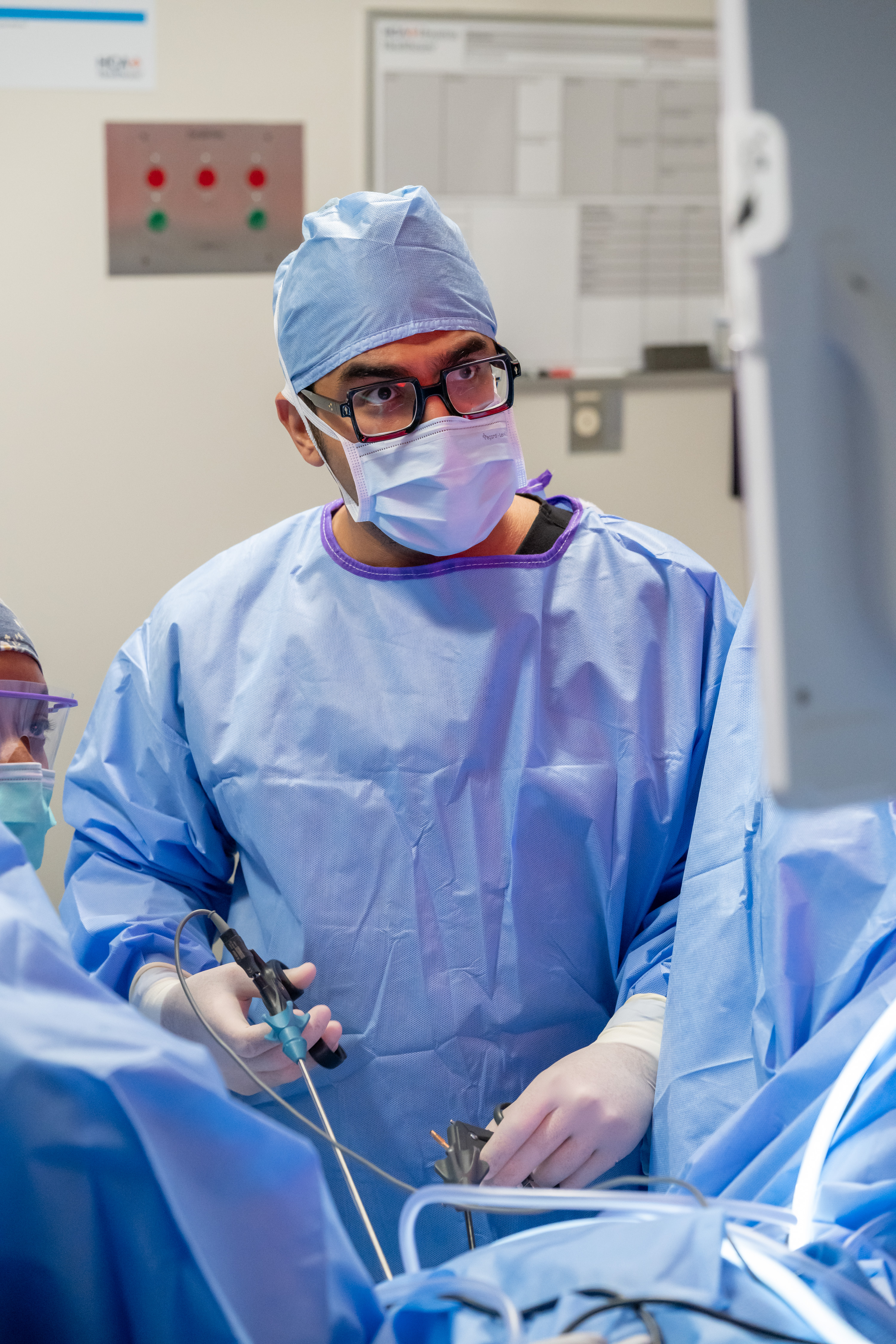 A physician concentrating during surgery