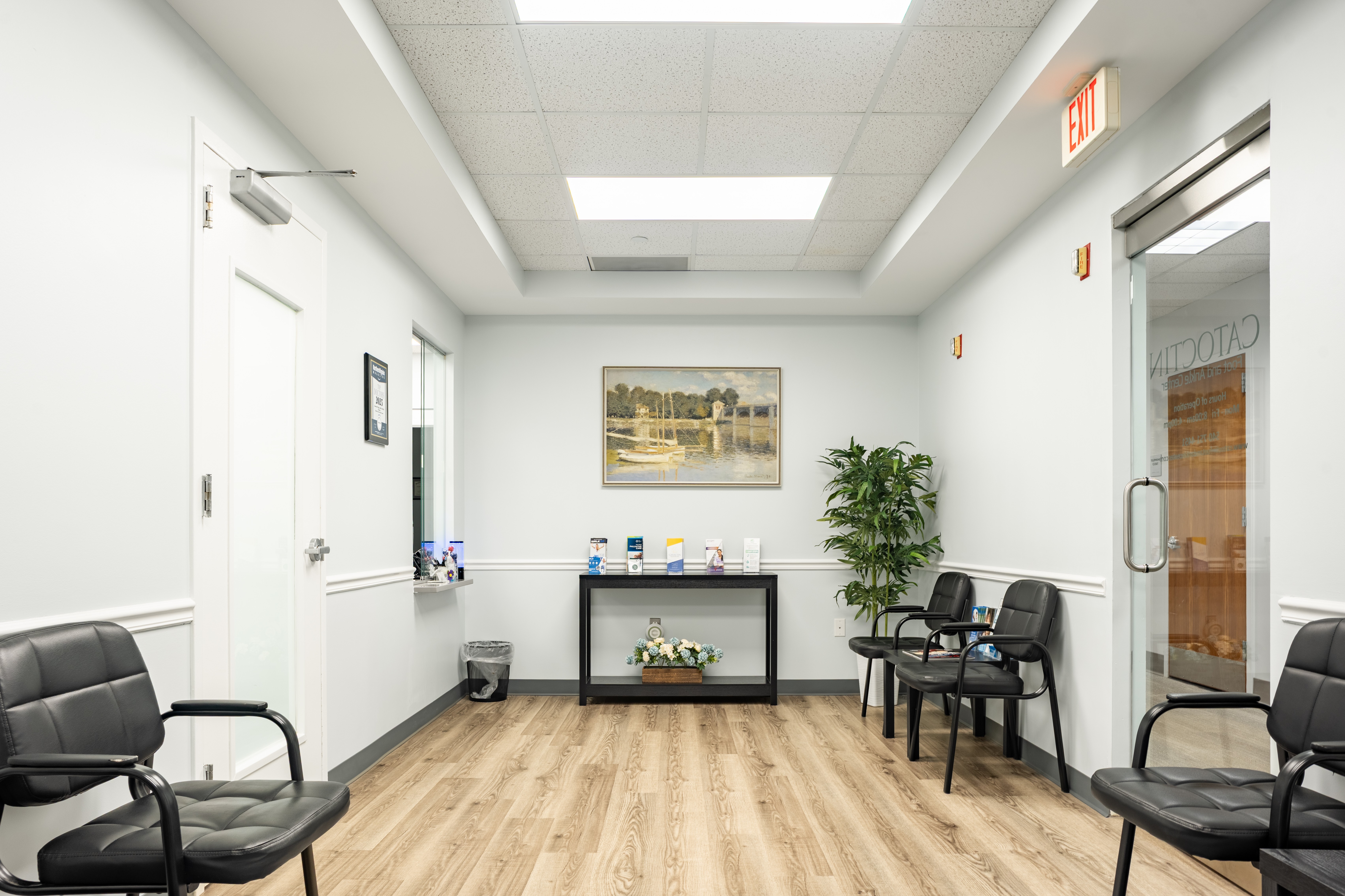 Seating and the check-in window in the clinic lobby