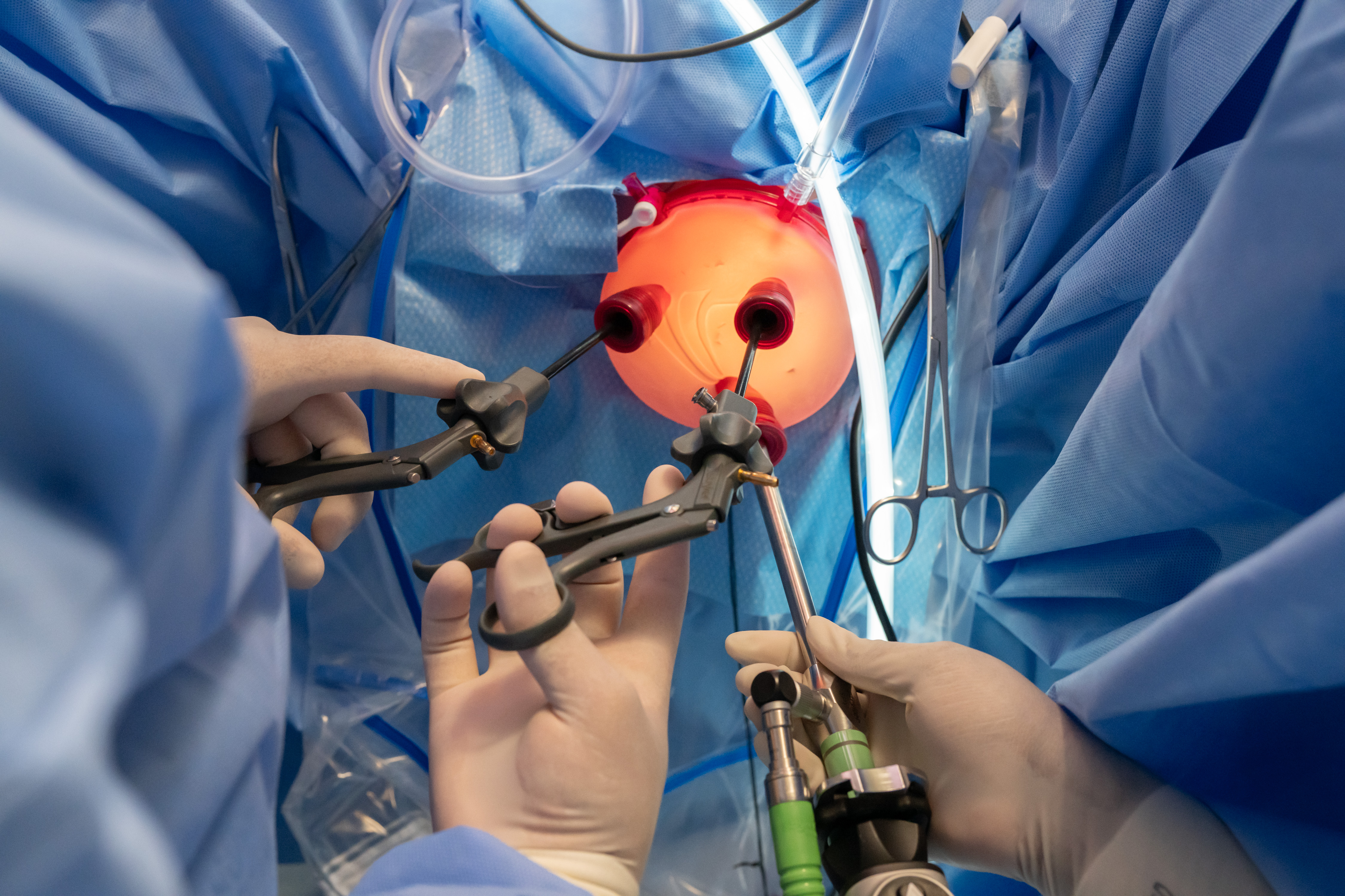 A physician displaying how the surgical tools are used during surgery