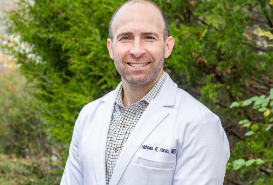 Dr. Nicholas Fiacco in front of a tree