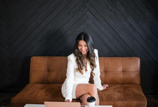 Dr. Sangha looking at her laptop