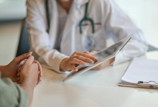 A physician explaining something to a patient