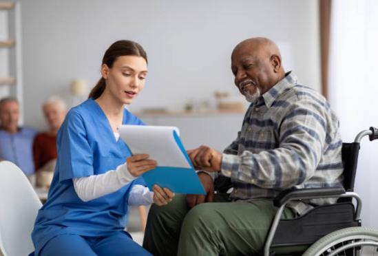 A provider explaining paperwork to a patient