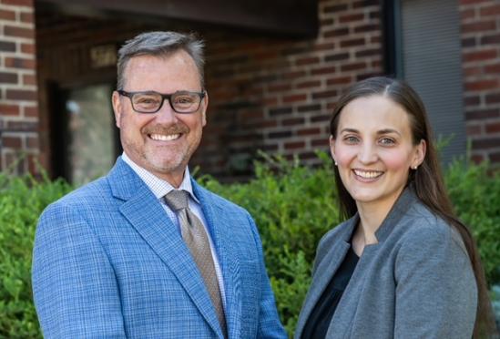 Dr. Jeffrey Schwein and Dr. Elizabeth Wakefield smiling outside