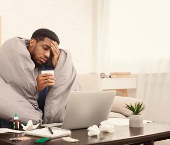 A man sick on his couch