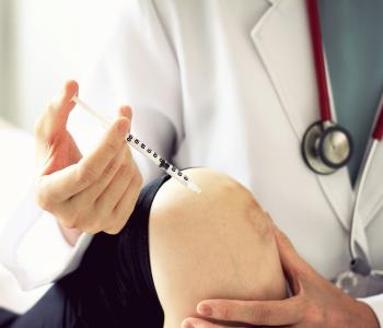 A patient getting a knee injection