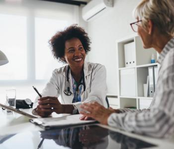 A physician explaining something to a patient