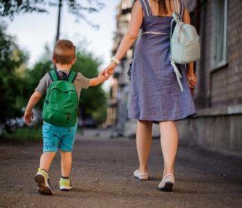 A mother walking her child to school