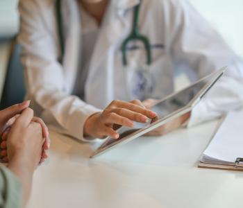 A physician explaining something to a patient