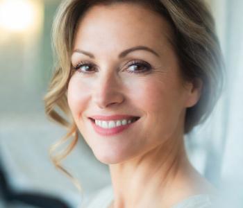 A smiling woman looking at the camera