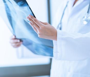 A physician examining an x-ray