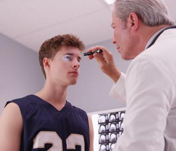 A physician conducting a physical 